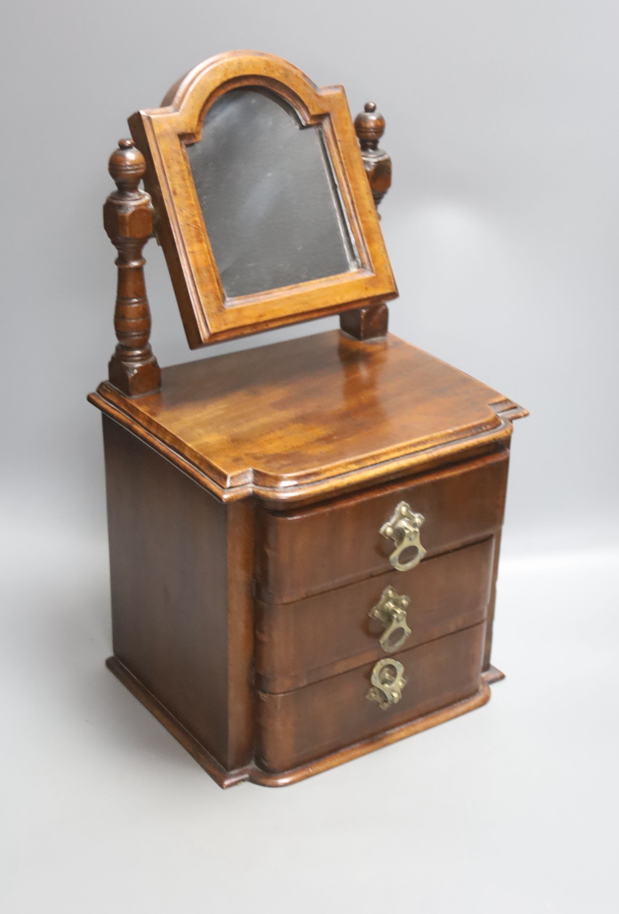 A Victorian walnut workbox and a miniature mahogany chest, height 42cm